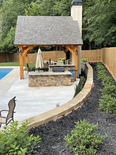 Image of a newly constructed grilling hut on top of new pavers. 